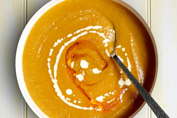 Bowl of parsnip soup, with a swirl of creme fraiche