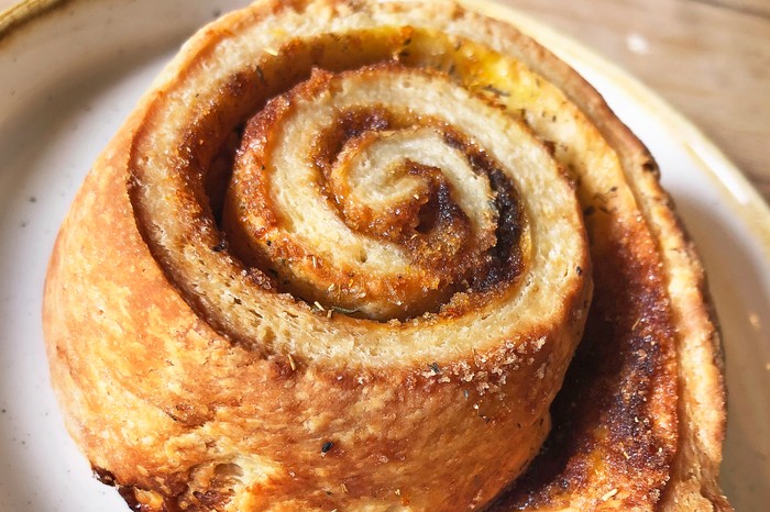 A golden, swirled bun filled with a brown sugar filling