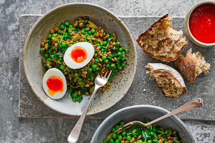 Spiced grains with peas, spinach and jammy eggs