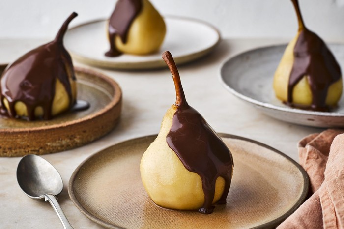 Four poached pears with pedro ximénez and chocolate sauce