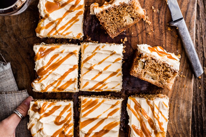 Toffee apple cake with cream cheese icing sliced into 8 separate squares